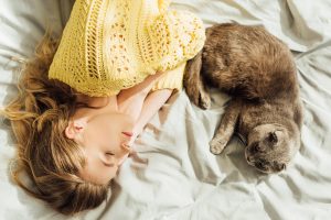 Why does my cat sleep with me and not my husband?